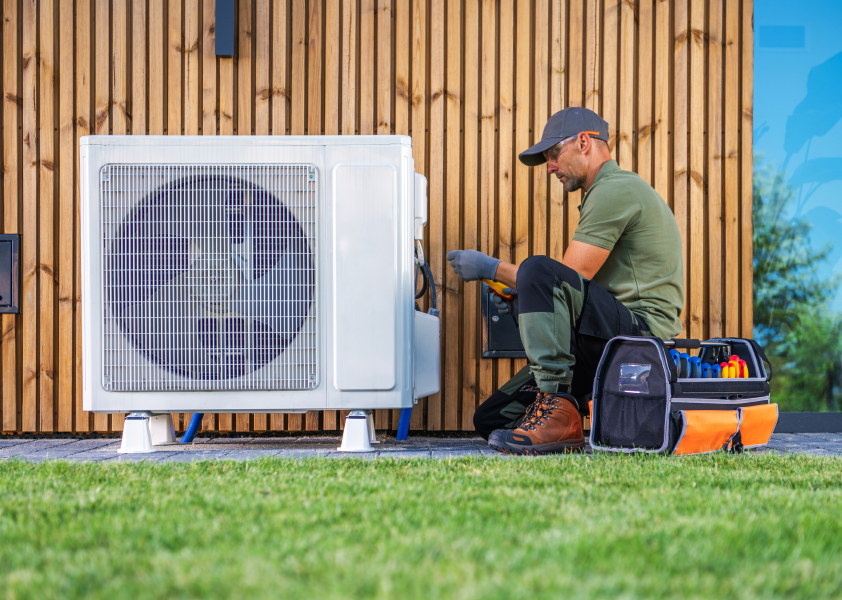 An HVAC pro working on an AC