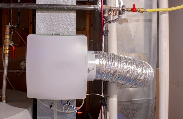 A furnace humidifier attached to the ductwork