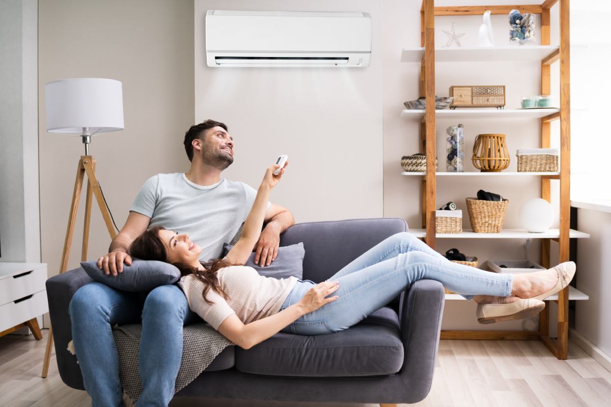 A couple enjoys their condo air conditioner