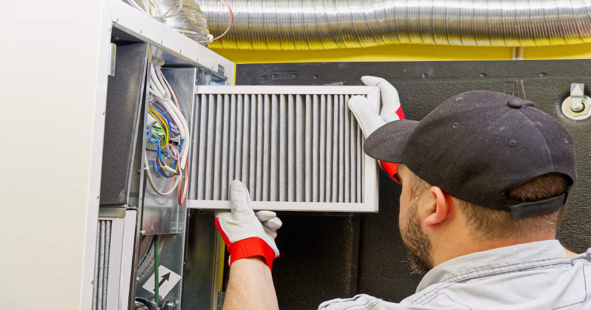 Man cleaning a furnace