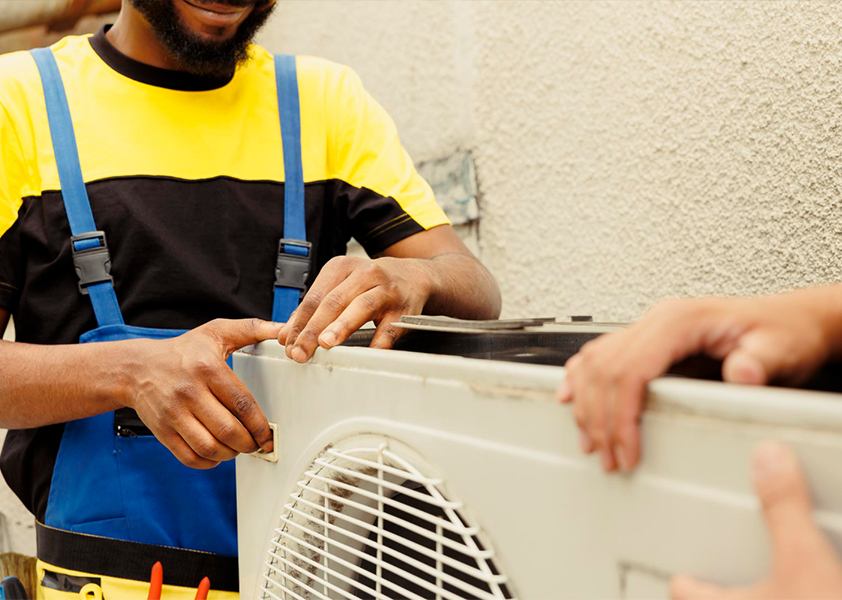 HVAC Technician installing a unit.